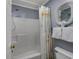 Clean bathroom with shower/tub, white toilet, and ocean-themed decor at 300 Shorehaven Dr. # I-2, North Myrtle Beach, SC 29582