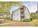 Two-story building with multiple balconies and screened porches at 400 Blue Stem Dr. # 60-E, Pawleys Island, SC 29585