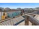 Wooden deck with railings and a bench, overlooking neighborhood at 431 28Th St. S, Sunset Beach, NC 28468