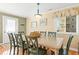 Dining area with light-toned table and green chairs, near entrance at 431 28Th St. S, Sunset Beach, NC 28468