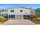 Elevated beach house exterior, gray siding, spacious deck at 431 28Th St. S, Sunset Beach, NC 28468