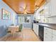 Kitchen features white cabinets, breakfast table, and ocean view at 431 28Th St. S, Sunset Beach, NC 28468