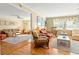 Open living area with wicker furniture and hardwood floors at 431 28Th St. S, Sunset Beach, NC 28468