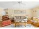 Bright living room features hardwood floors, comfy seating, and tasteful artwork at 431 28Th St. S, Sunset Beach, NC 28468