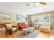 Living room with wicker furniture, hardwood floors, and coastal decor at 431 28Th St. S, Sunset Beach, NC 28468