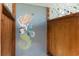 Outdoor shower with artistic mermaid painting on the wall at 431 28Th St. S, Sunset Beach, NC 28468