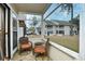 Relaxing screened porch with wicker furniture, overlooking a courtyard at 4450 Little River Inn Ln. # 602, Little River, SC 29566