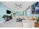 Living room with off-white sectional sofa, ceiling fan, and ocean view at 5700 Ocean Blvd. N # Ph 12, North Myrtle Beach, SC 29582