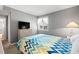 Bright bedroom with a comfy bed and TV at 609 Hillside Dr. S # D-17, North Myrtle Beach, SC 29582