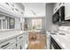 Bright kitchen with white cabinets and a dining area at 609 Hillside Dr. S # D-17, North Myrtle Beach, SC 29582