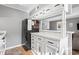 White cabinets, black appliances, and a breakfast bar at 609 Hillside Dr. S # D-17, North Myrtle Beach, SC 29582