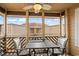 Relaxing screened porch with outdoor seating and ceiling fan at 609 Hillside Dr. S # D-17, North Myrtle Beach, SC 29582