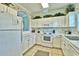 White kitchen with ample counter space and appliances at 6203 Catalina Dr. # 1822, North Myrtle Beach, SC 29582