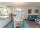 Charming dining area with a light wood table and white chairs, adjacent to kitchen at 690 Riverwalk Dr. # 201, Myrtle Beach, SC 29579