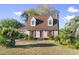 Front view of a house with a garage and landscaping at 702 Plantation Dr., Surfside Beach, SC 29575