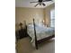 Bedroom with a post bed and ample natural light at 729 Woodcrest Way, Murrells Inlet, SC 29576