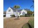 Single story home with attached garage and palm tree at 729 Woodcrest Way, Murrells Inlet, SC 29576