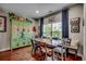 Charming dining area with rustic farmhouse table and built-in bench at 8605 Hopper Ct., Myrtle Beach, SC 29579