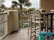Balcony with partial pool view and seating at 9994 Beach Club Dr. # 103, Myrtle Beach, SC 29572