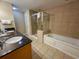 Bathroom with double vanity, soaking tub, and shower at 9994 Beach Club Dr. # 103, Myrtle Beach, SC 29572