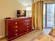 Bedroom with dresser and access to a balcony at 9994 Beach Club Dr. # 103, Myrtle Beach, SC 29572