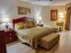 King bedroom with wood furniture and neutral decor at 9994 Beach Club Dr. # 103, Myrtle Beach, SC 29572