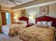 Guest bedroom with two double beds and ceiling fan at 9994 Beach Club Dr. # 103, Myrtle Beach, SC 29572