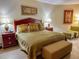 King bedroom with wood furniture and neutral decor at 9994 Beach Club Dr. # 103, Myrtle Beach, SC 29572