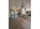 Spacious living area with kitchen, fireplace and LVP flooring at Tbb 20 Privetts Rd., Conway, SC 29526