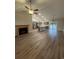 Open living space with LVP flooring, a fireplace, and kitchen island at Tbb 20 Privetts Rd., Conway, SC 29526