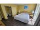 Bedroom with queen-size bed and adjacent bathroom at 2701 S Ocean Blvd. # 809, North Myrtle Beach, SC 29582