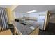 Compact kitchen with granite countertops and white cabinets at 2701 S Ocean Blvd. # 809, North Myrtle Beach, SC 29582