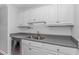 White cabinets, gray countertops, and double sink at 4303 N Ocean Blvd. # C2, North Myrtle Beach, SC 29582