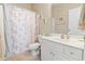 Simple bathroom with white vanity and seashell decor at 4519 N Plantation Dr. # X-9, Little River, SC 29566