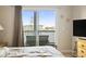Bedroom with balcony access and water views at 4519 N Plantation Dr. # X-9, Little River, SC 29566