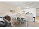 Kitchen and dining area with breakfast bar and glass table at 4519 N Plantation Dr. # X-9, Little River, SC 29566