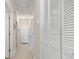 Clean hallway with tile flooring and neutral walls at 4519 N Plantation Dr. # X-9, Little River, SC 29566