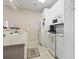Bright kitchen with white cabinets, appliances, and light countertops at 4519 N Plantation Dr. # X-9, Little River, SC 29566