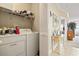 Laundry room with washer, dryer, and shelving at 4519 N Plantation Dr. # X-9, Little River, SC 29566