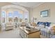 Living room with water views and comfortable seating at 4519 N Plantation Dr. # X-9, Little River, SC 29566
