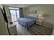 Main bedroom with a king-size bed and ocean view at 501 S Ocean Blvd. # 601, North Myrtle Beach, SC 29582