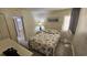Bright bedroom with seashell bedding and ocean view art at 501 S Ocean Blvd. # 601, North Myrtle Beach, SC 29582