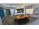 Wooden dining table with chairs, kitchen access at 501 S Ocean Blvd. # 601, North Myrtle Beach, SC 29582