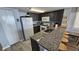 Modern kitchen with granite countertops and breakfast bar at 501 S Ocean Blvd. # 601, North Myrtle Beach, SC 29582