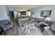 Living room with gray sofas and coffee table at 501 S Ocean Blvd. # 601, North Myrtle Beach, SC 29582