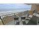 Stunning ocean view from balcony with comfortable seating at 501 S Ocean Blvd. # 601, North Myrtle Beach, SC 29582
