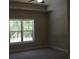 Bright bedroom with carpeted floor and large window overlooking wooded area at Tbd 15 Mineral Springs Rd., Conway, SC 29527