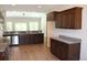 Open concept kitchen with dark cabinets, granite countertops and stainless steel appliances at Tbd 15 Mineral Springs Rd., Conway, SC 29527