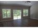 Bright living room with hardwood floors, multiple windows and sliding glass doors at Tbd 15 Mineral Springs Rd., Conway, SC 29527