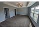 Spacious primary bedroom with large windows and carpet at Tbd 17 Mineral Springs Rd., Conway, SC 29527